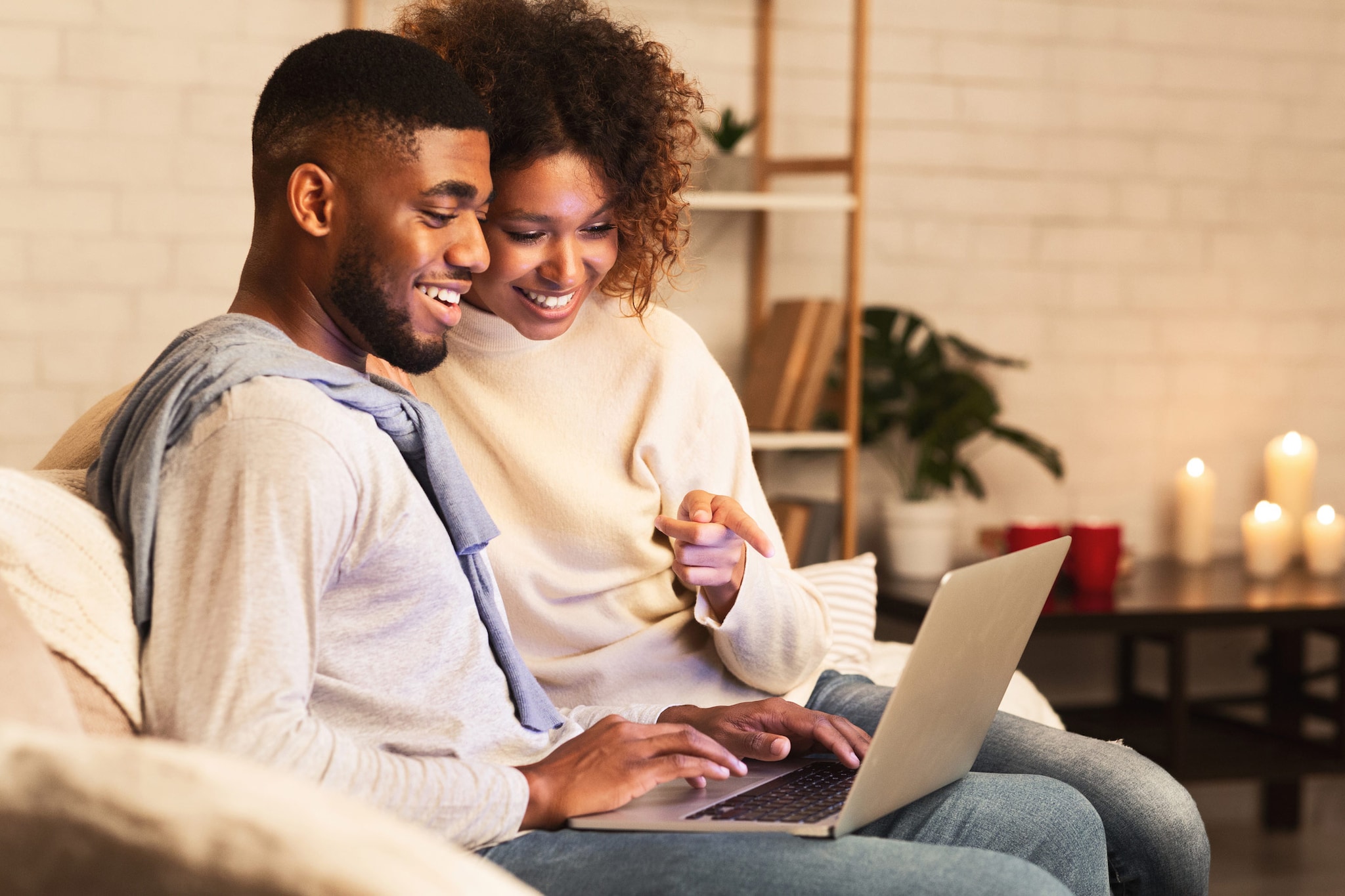 Couple looking at a laptop together